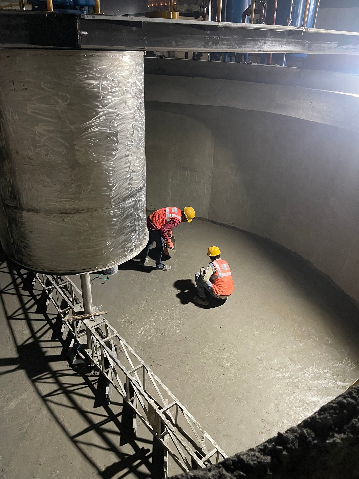 Engineers finishing a circular clarifier floor